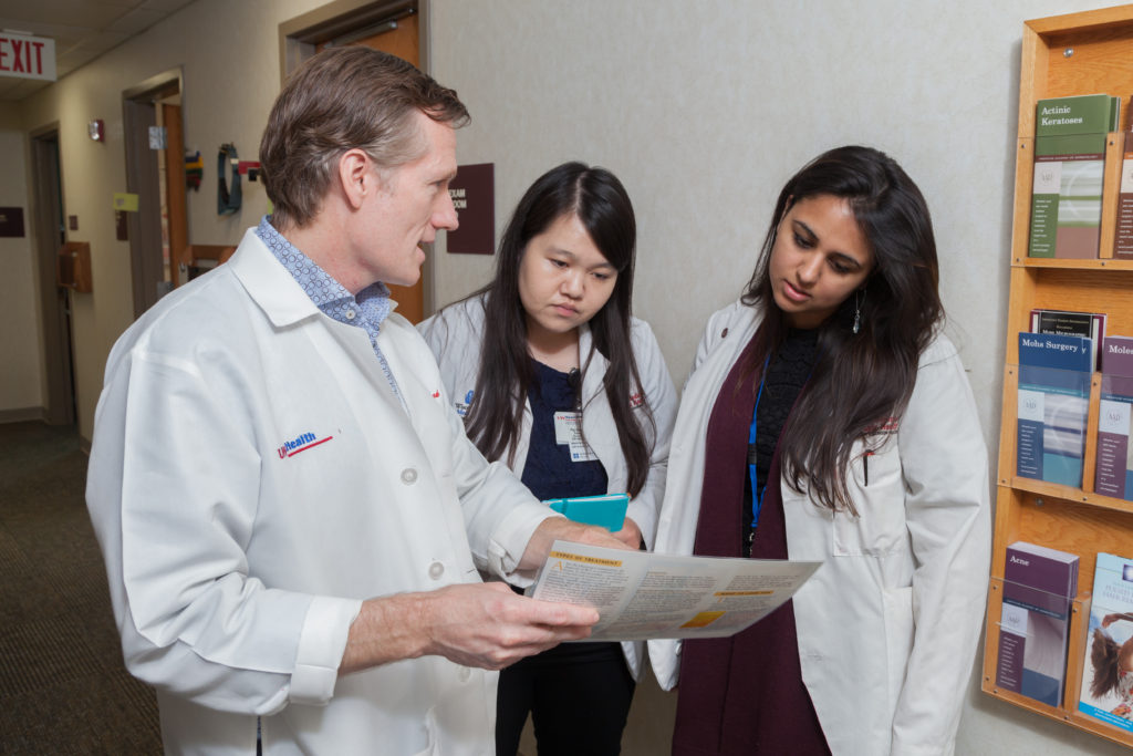 image of faculty and students